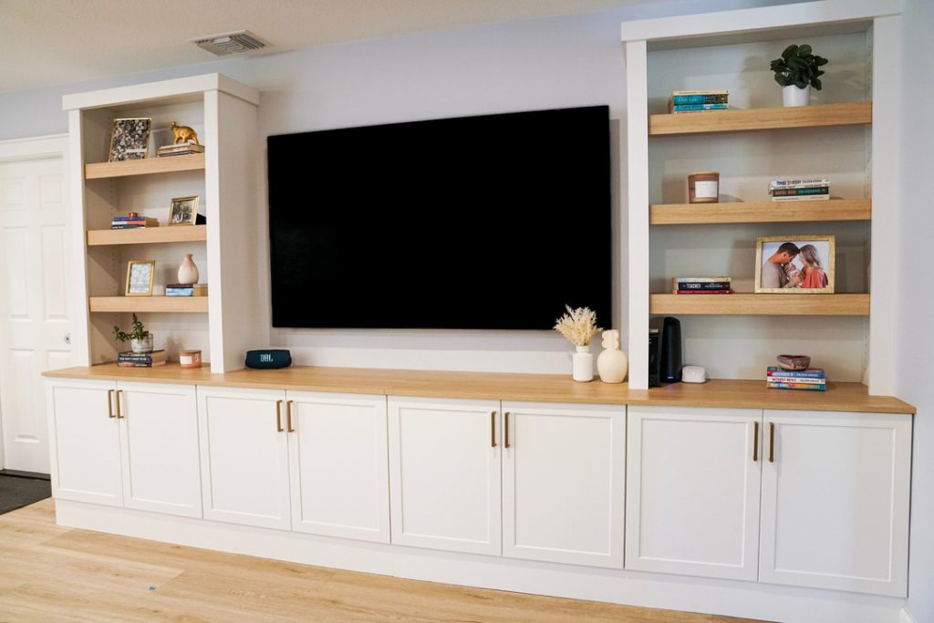 Picture of livingroom storage solutions with shelving and cabinets.