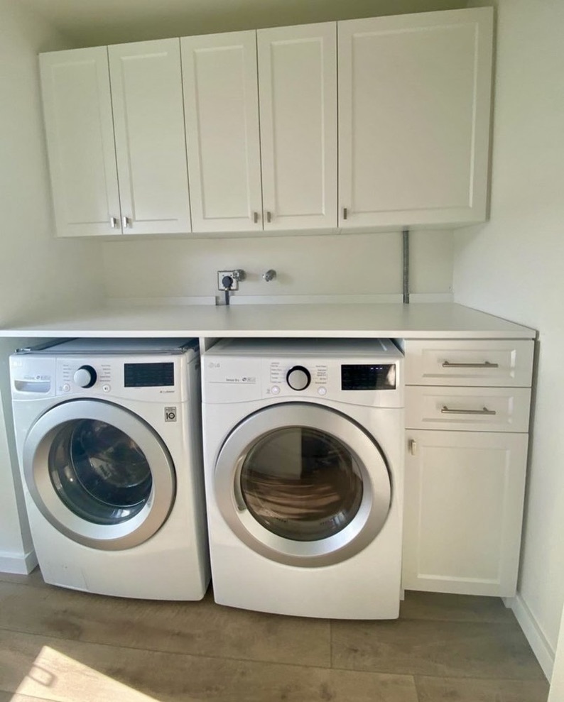 Image of a custom laundry room with overhead storage.