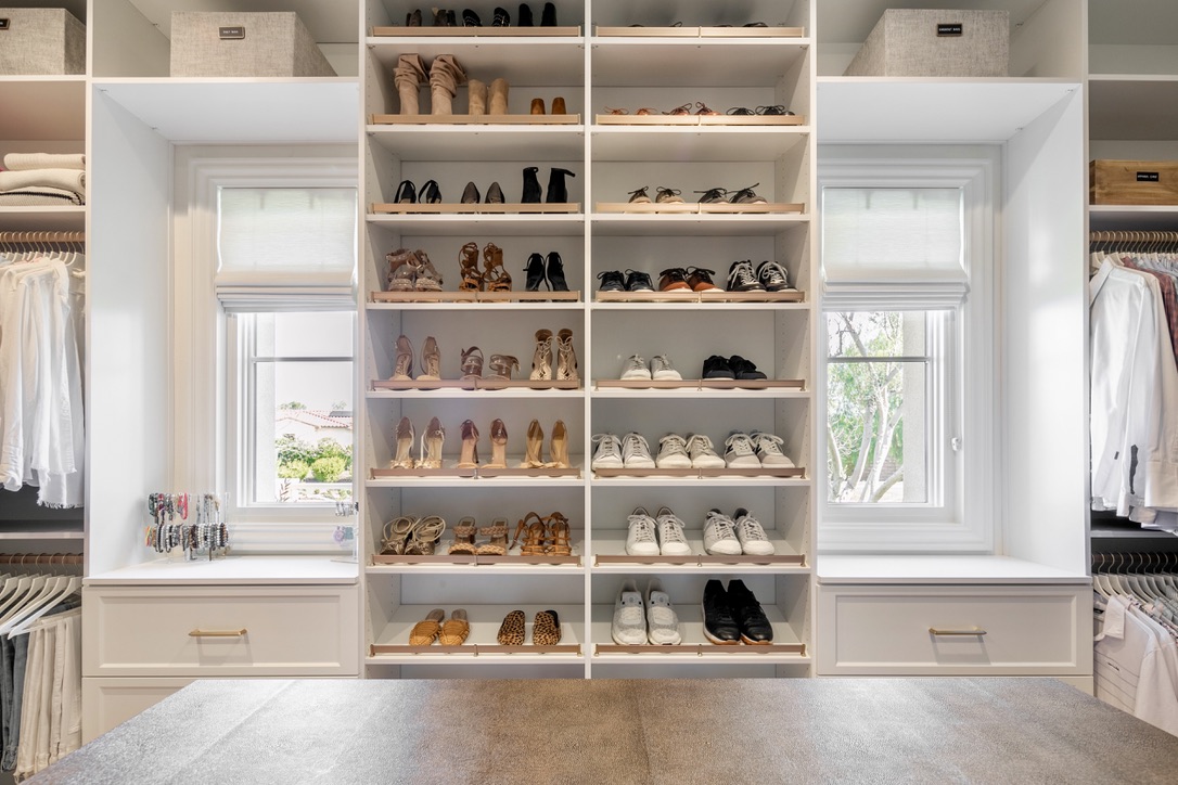 Shoe closet design and storage in women's custom closet in Orange County, CA.