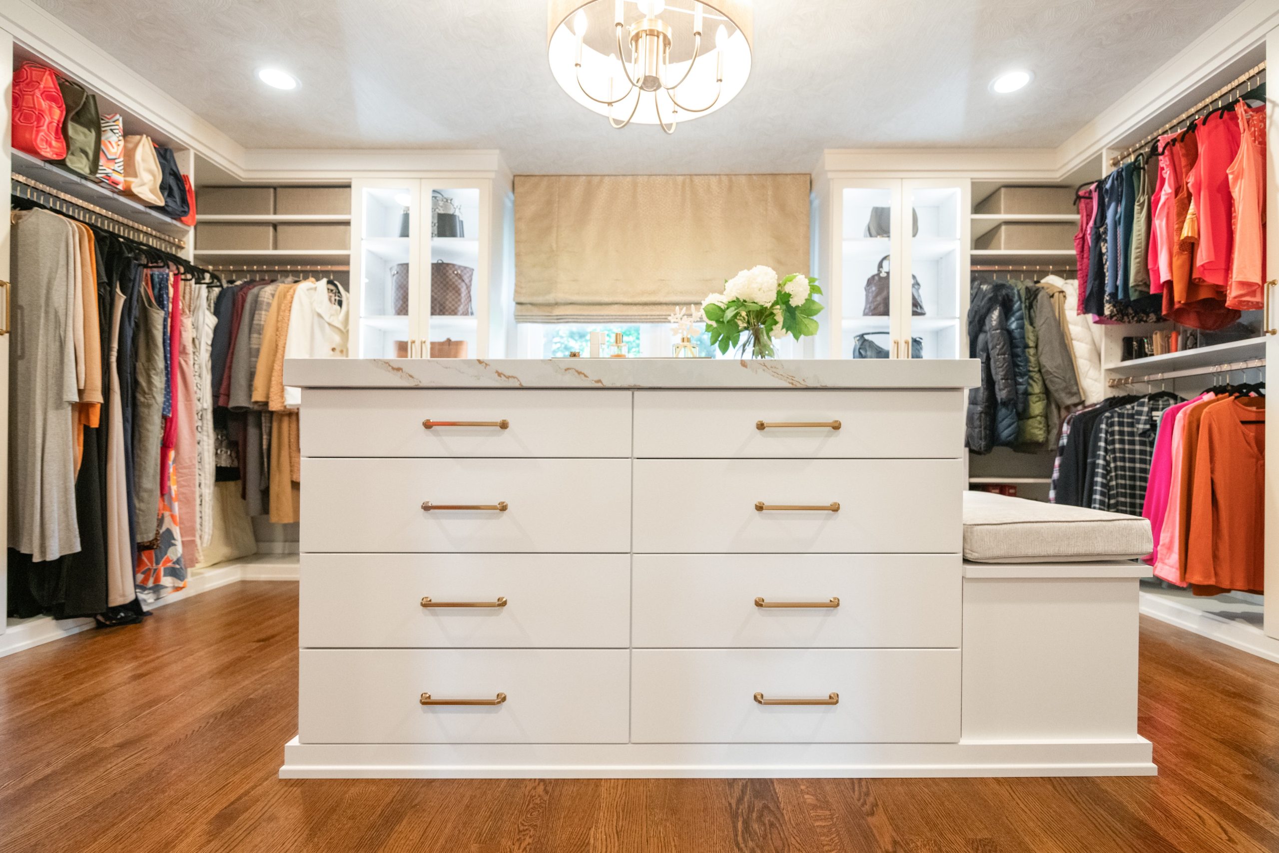 Image of a well designed closet with closet center island in Newport Beach.