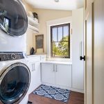 Custom laundry room with storage closets