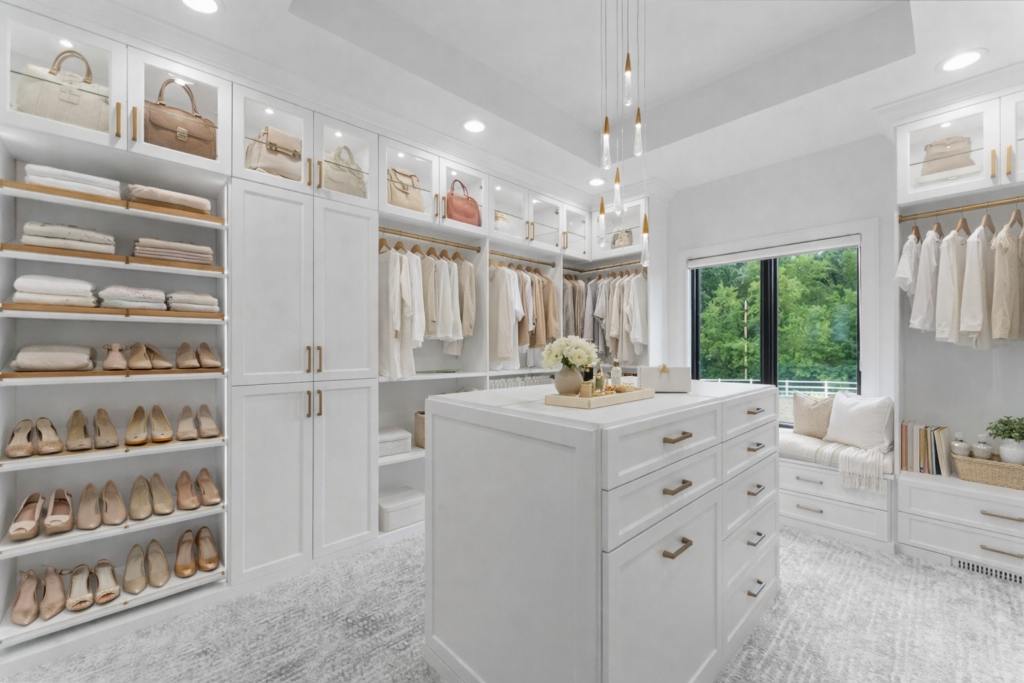 Image of closet center island for accessory storage in Newport Beach home.