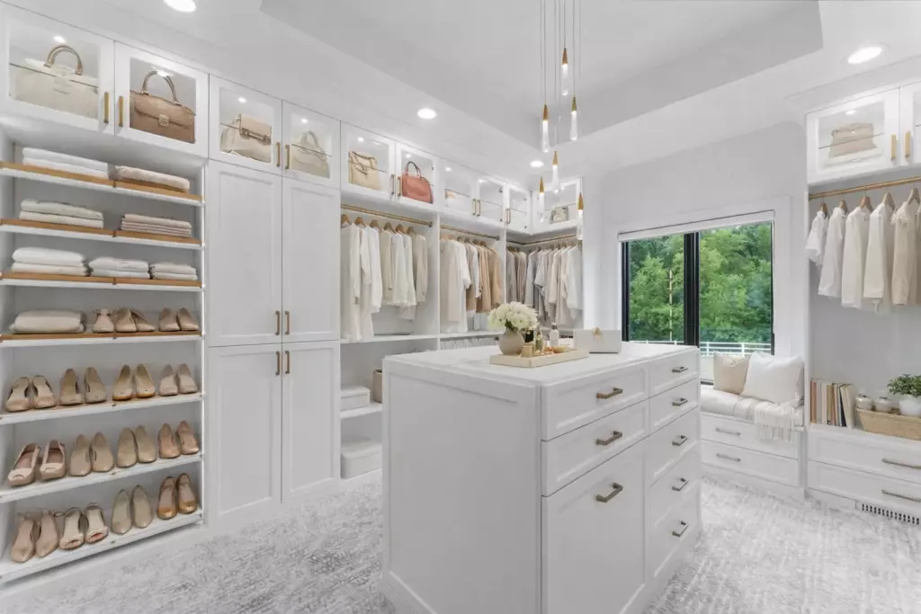 Image of a custom designed closet with a closet island with drawers