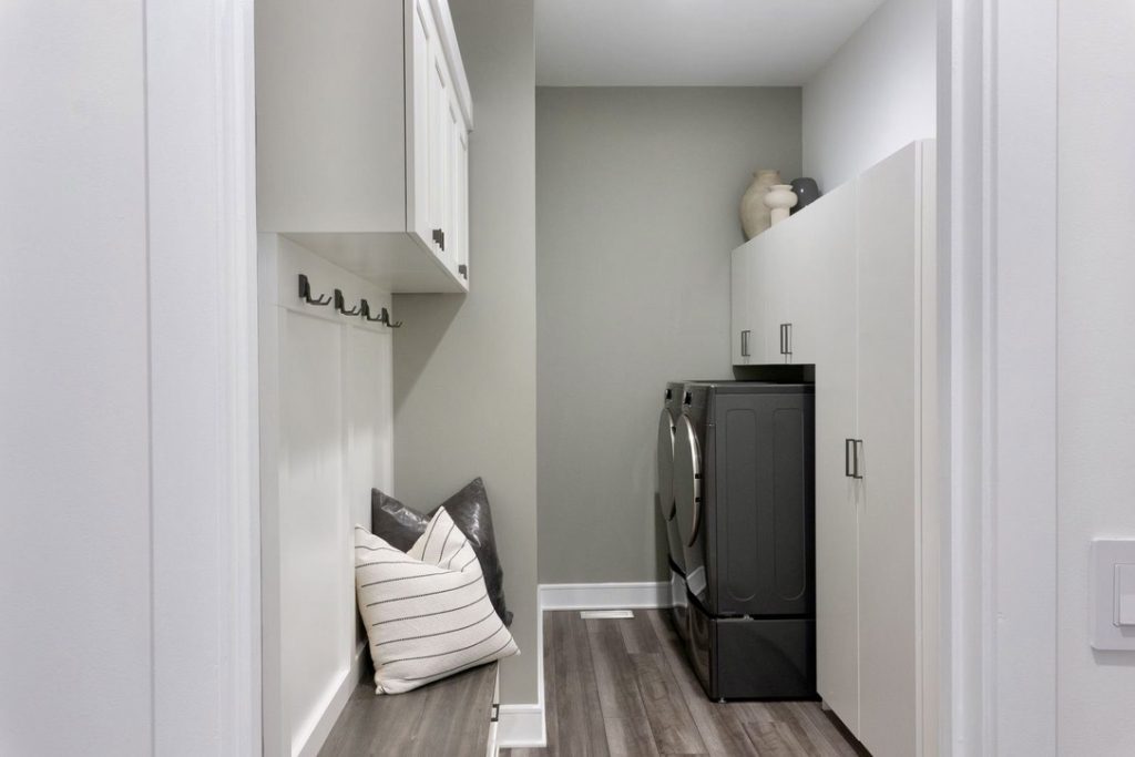 Baskets and custom shelves for a laundry room image.