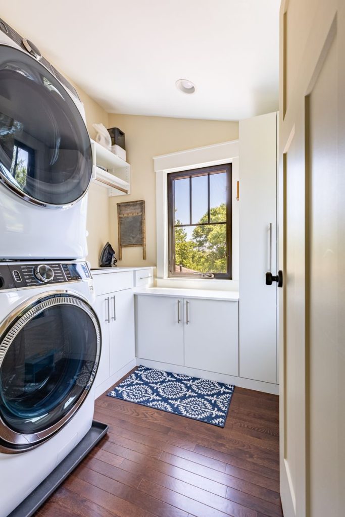 Custom laundry room with storage closets